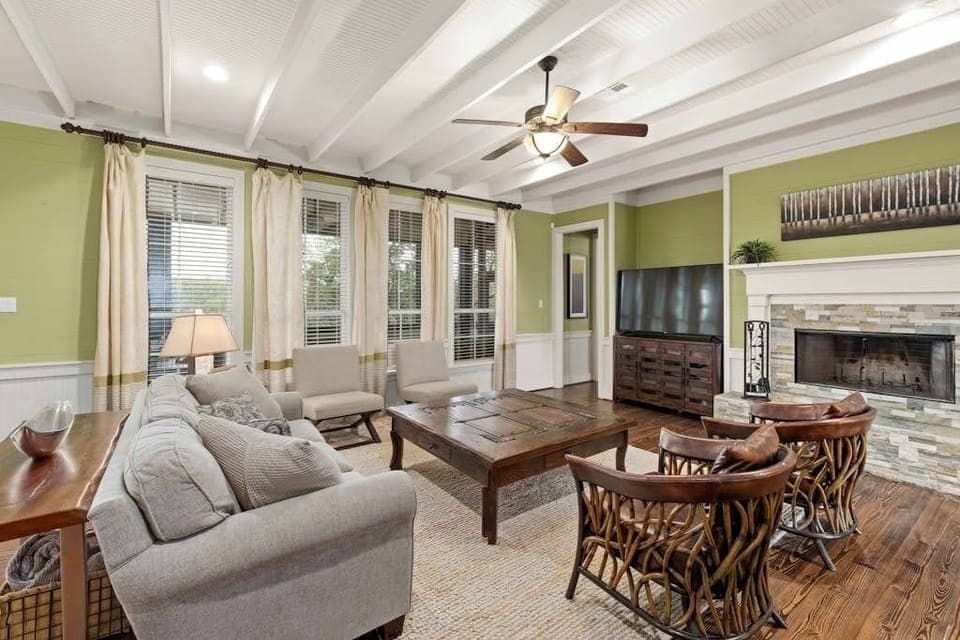 Living room with wood burning fireplace in the primary house.