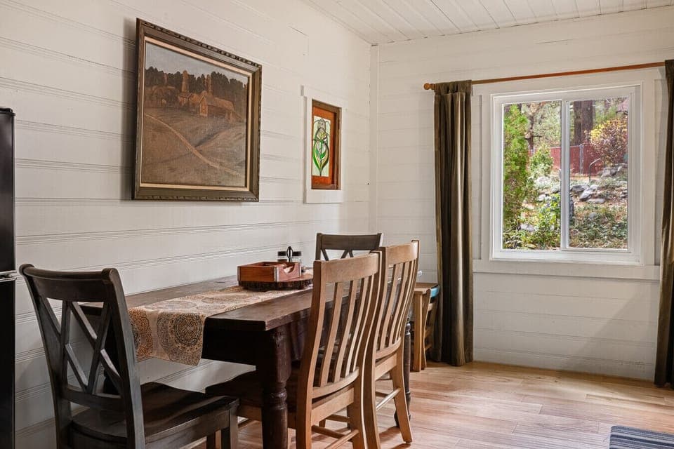 Bright kitchen with a dining table that comfortably seats four, perfect for meals together.