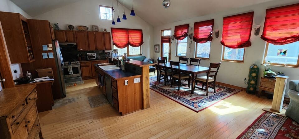 Living area with dining room and kitchen.