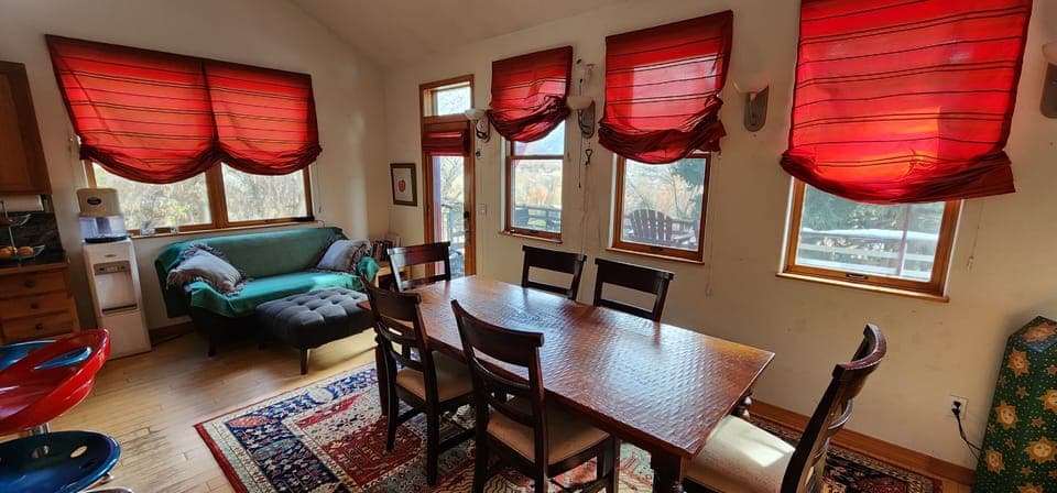 Living area with dining room and reading nook.