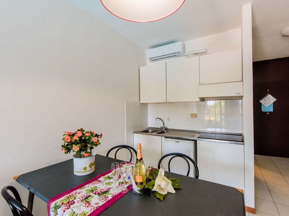 Cabinetry, Property, Furniture, Table, Countertop, Interior Design, Kitchen, Flower, Lighting, Sink