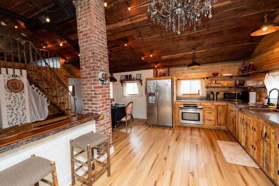 Cook up memories in this spacious country kitchen, complete with wood-beam ceilings and vintage vibes.