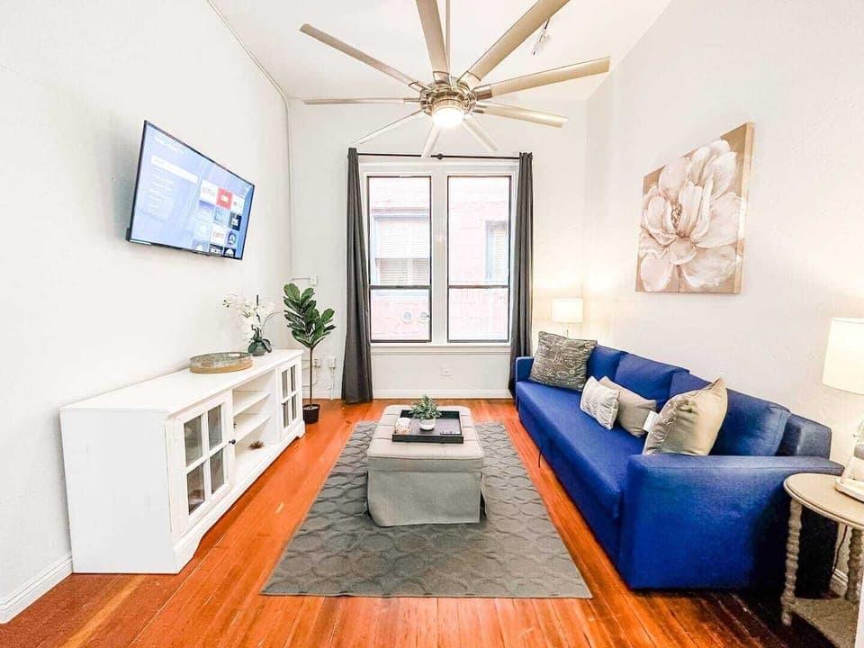 Welcome to your 700 sq ft. Suite with high ceilings.  Sit back and relax in the living room area that includes (1) sofa bed and (1) futon as well as a 50 inch ROKU Smart TV