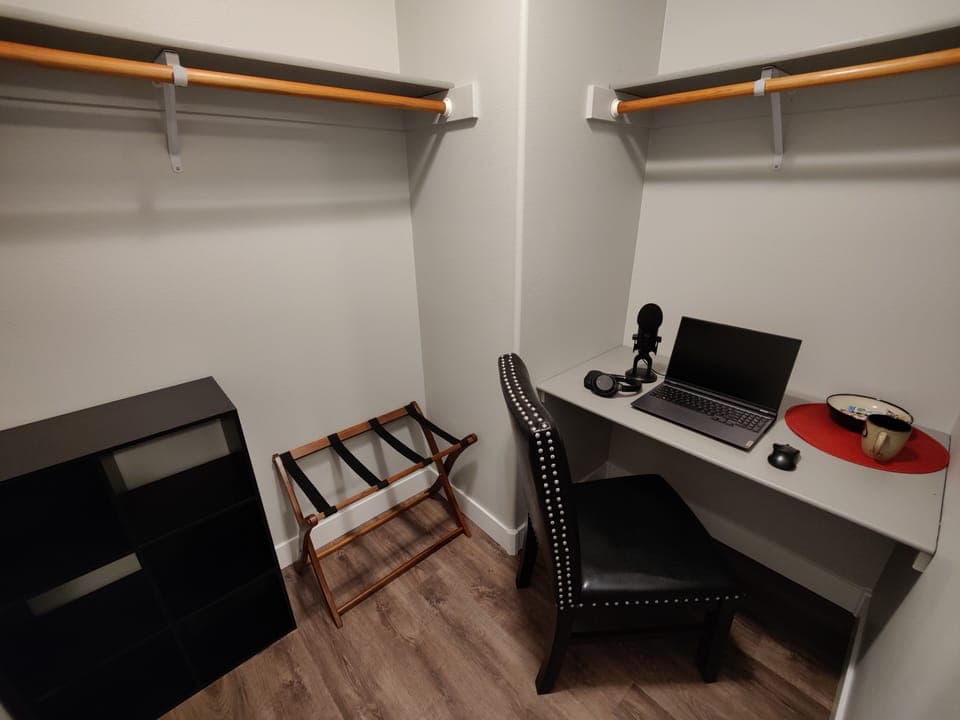 THE FLEXIBLE BEDROOM closet is unique and can double as a second computer desk.