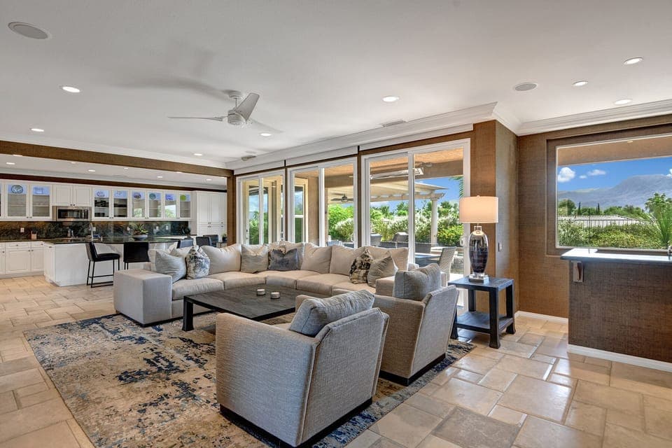 LIVING ROOM TO KITCHEN AND POOL AND YARD