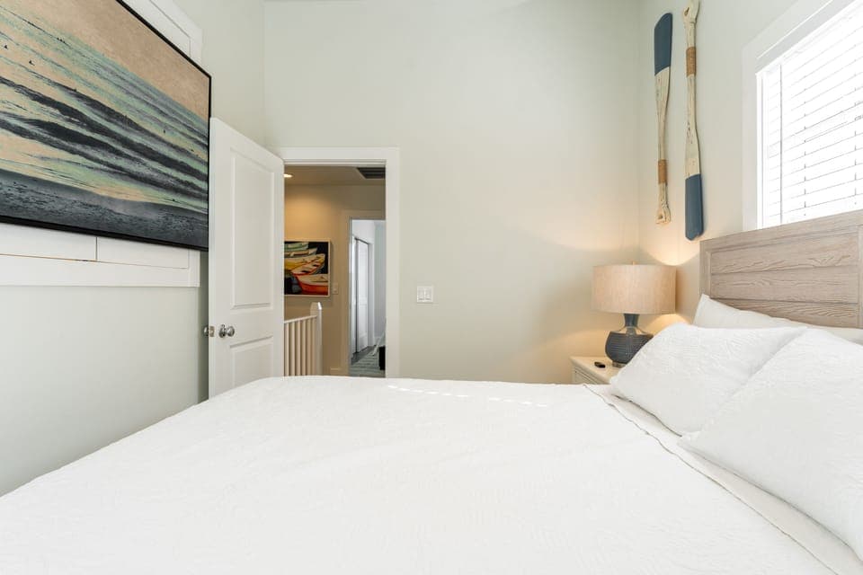 Bedroom 2 features a queen bed.