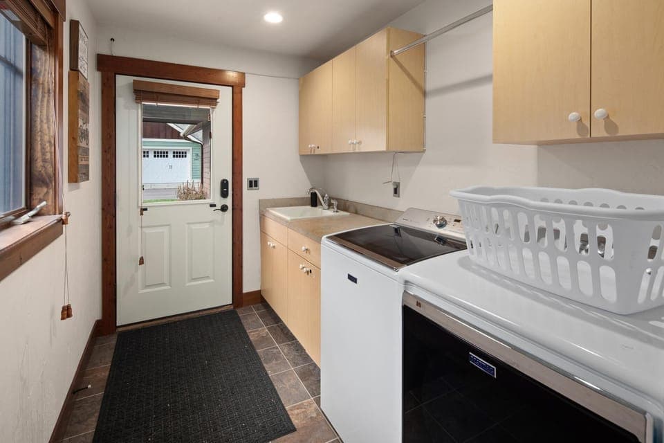 The laundry/mud room features brand new washer and dryer and not pictured is a gear storage room with industrial boot warmers