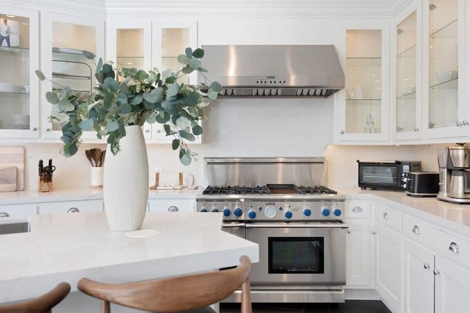 Top-of-the-line stainless steel appliances makes cooking a dream in the open kitchen