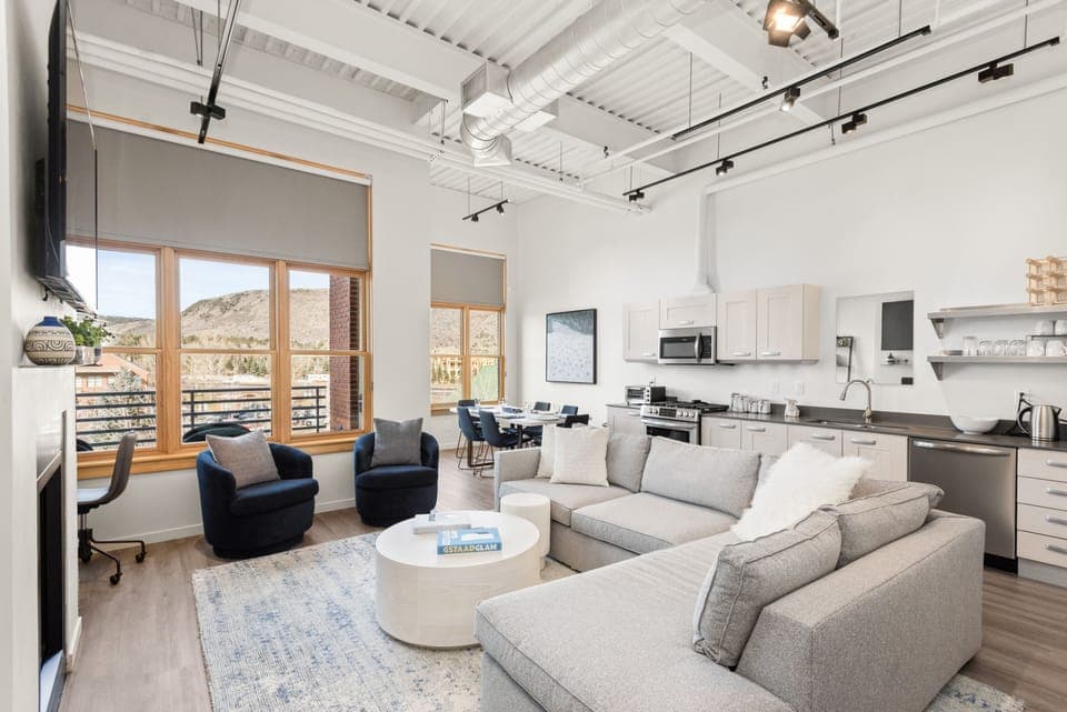 A welcoming, open and comfortable living room with pull out queen couch.