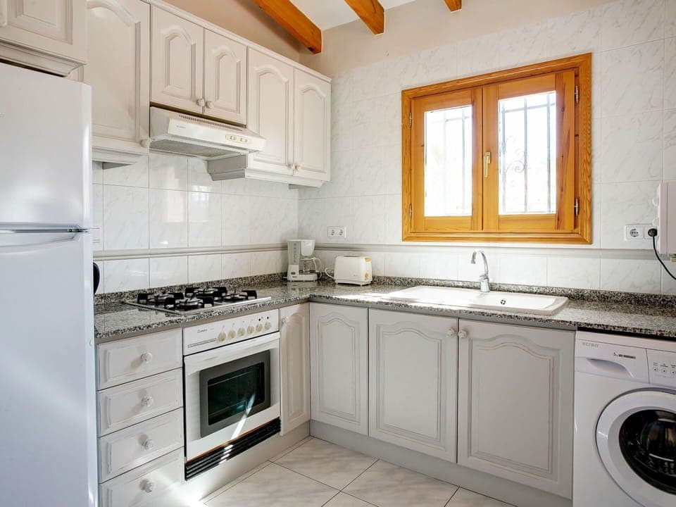 Cabinetry, Property, Countertop, Sink, White, Building, Window, Kitchen Stove, Tap, Kitchen