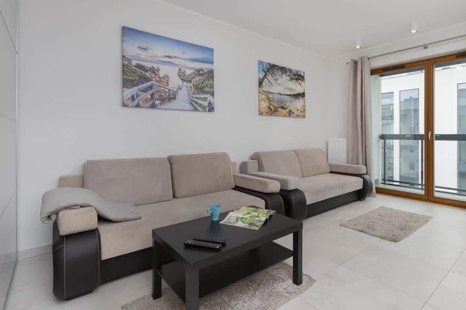 Living room with a comfortable sofa and TV. 
