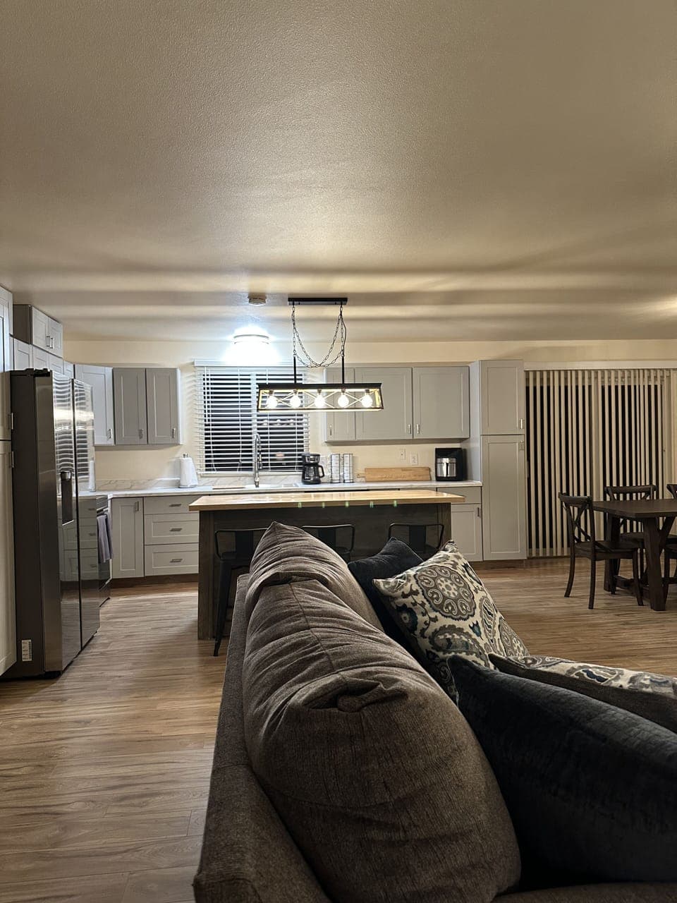 Large open kitchen with butcher block island 