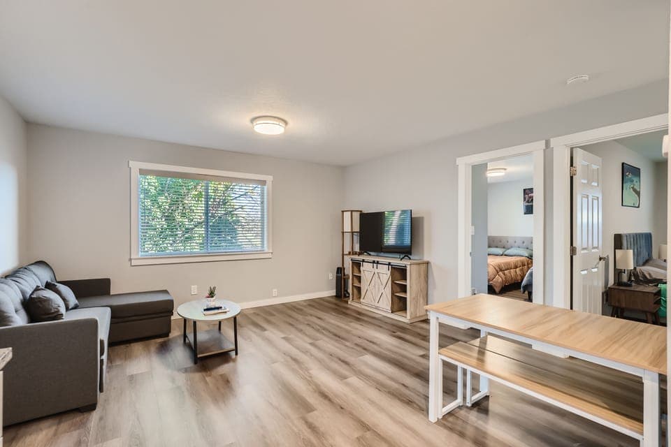 Living room with 50" UHD TV. Disney+, HBO MAX, and Amazon Prime Video