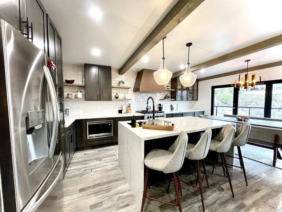 Gourmet kitchen and designer dining spaces made for gathering