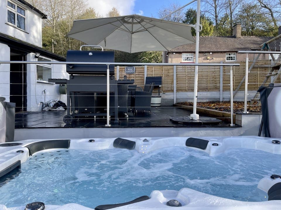 Large Jacuzzi with a barbecue patio. 