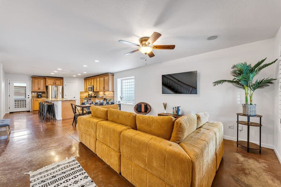 Relax into your Reno Tahoe vacation in our comfortable, open concept living/dining area, with heated floors, mounted TV, and plenty of natural light.