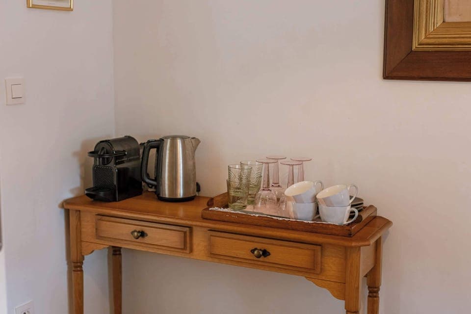 In-room coffee & tea station with kettle and cups