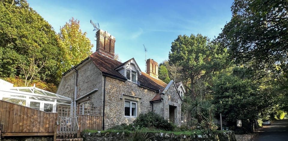 View the front exterior of 2 Aspe Castle Cottage, complete with convenient parking, located near Shanklin on the Isle of Wight.
