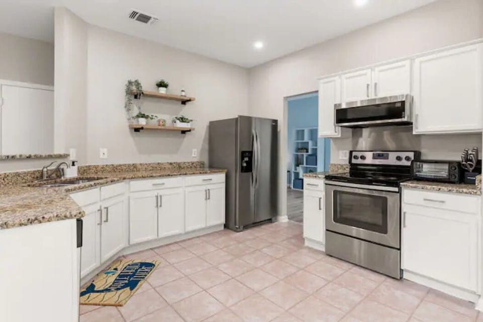 Prepare meals for your loved ones in this fully equipped & stocked open kitchen