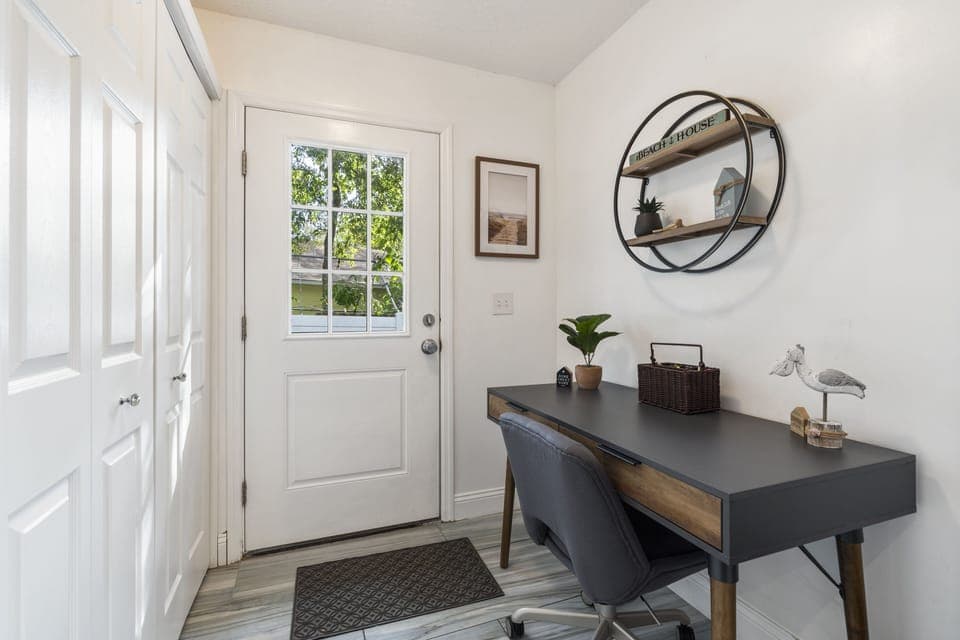 The office space with a comfortable chair, a desk and basic office supplies.