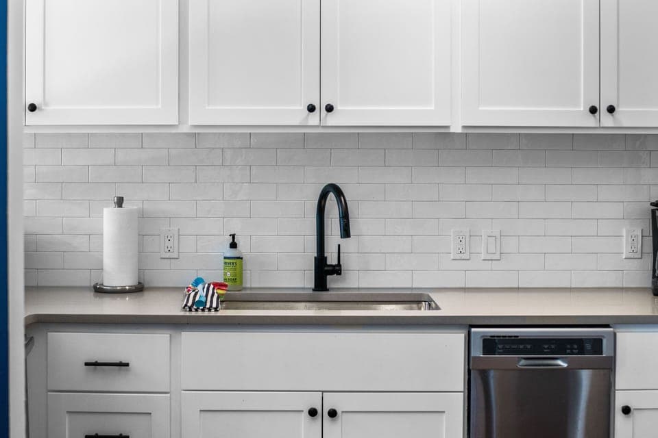 Updated kitchen: new cabinets, counter tops, and backsplash.