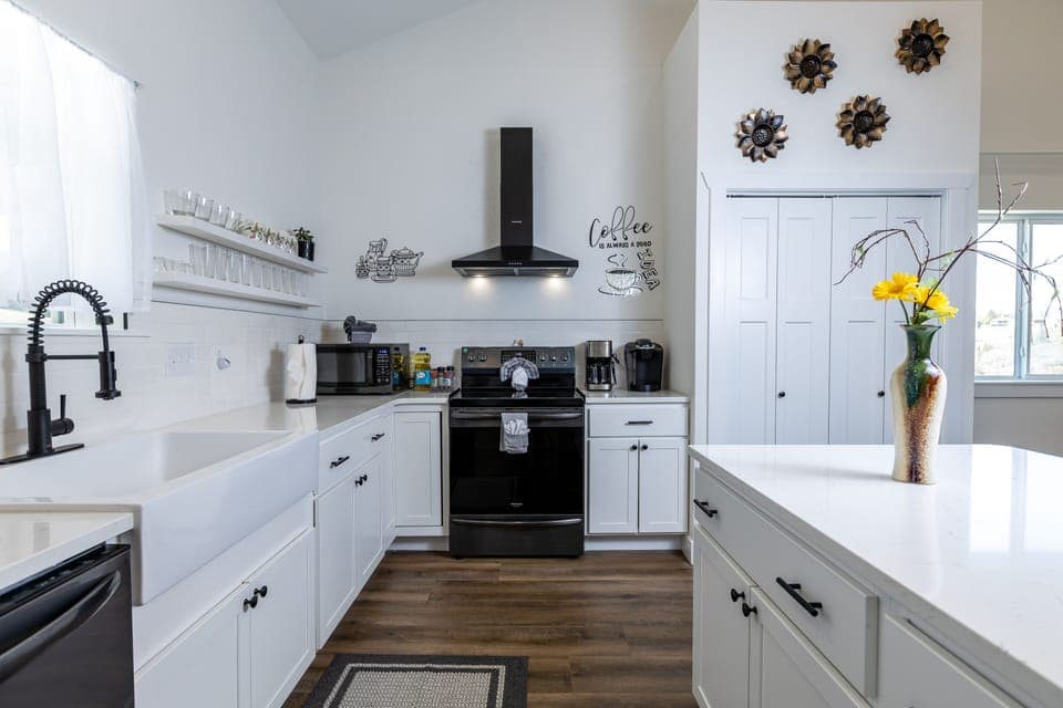 Open kitchen with all utensils and cookware