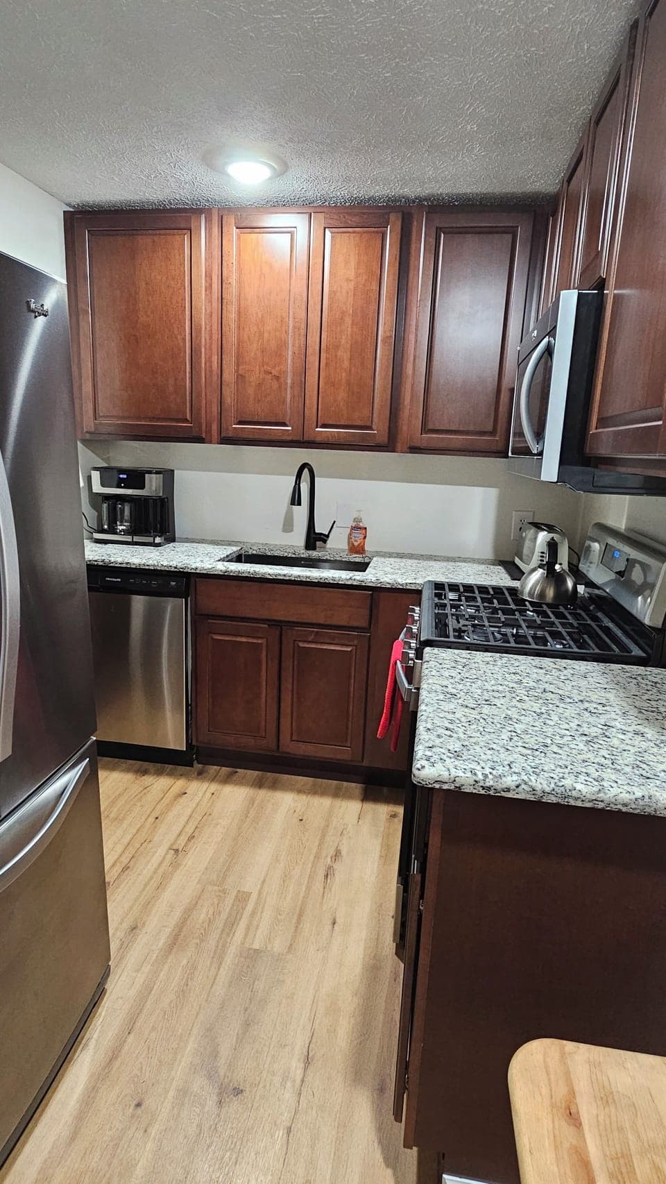 Kitchen -renovated in June 23 with new floors, cabinets, counters and appliances