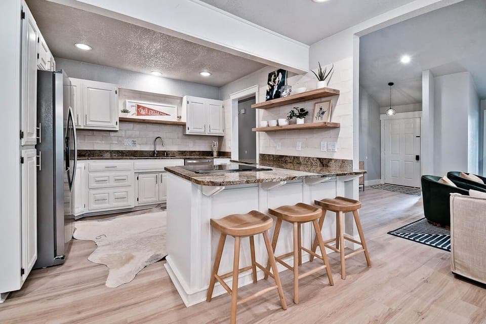 New appliances in the open kitchen with bar seating 