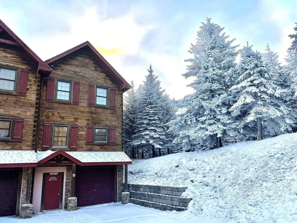 Enjoy the privacy of being the end unit, with easy access to the slope.