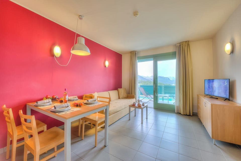 Living area with sofa bed and balcony view