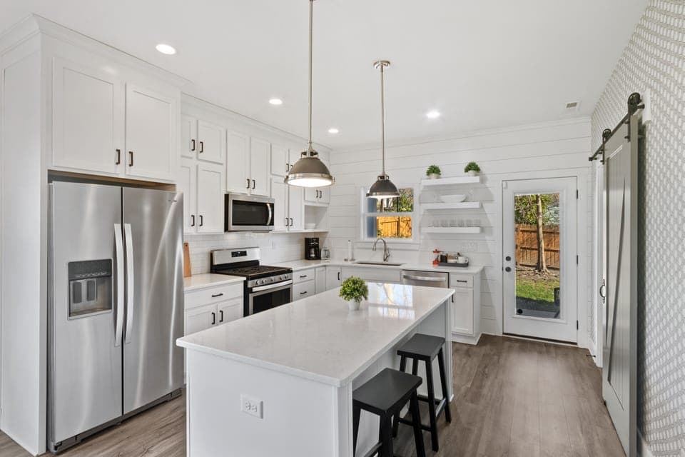 Marble peninsula features two extra counter stools