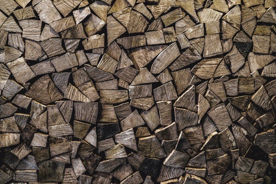 Stacked wood wall by the bar. Just don't pull any of it out...  It's just for ambiance. It's not firewood for burning! LOL...