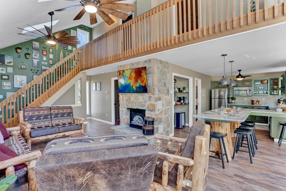 Enjoy quality time with loved ones in the open-concept upstairs space, perfect for making memories with family and friends. The unique charm of real tree stumps supporting the counter adds a touch of nature’s beauty, making it a beloved feature by all.