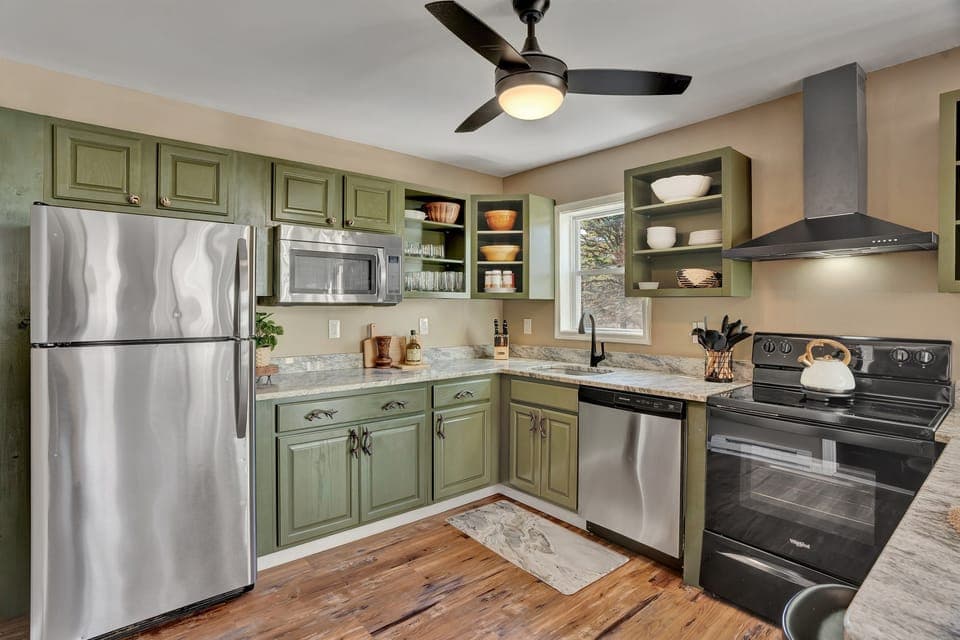 The well-equipped kitchen includes all the typical plates, bowls, utensils, pots, pans, and cooking tools.  A sampling of spices, olive oil, and other items are also supplied