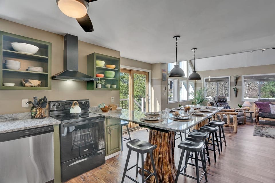 The spacious kitchen has room for making large meals, and the jumbo granite counter has more than enough room for 10 people to enjoy
