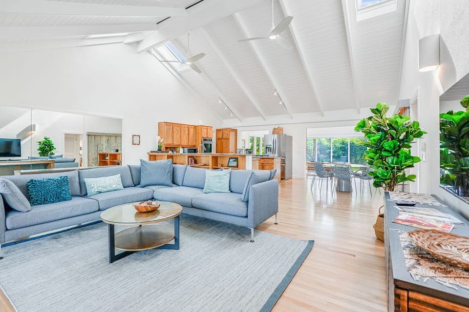 Large, open beam living area with garden views.