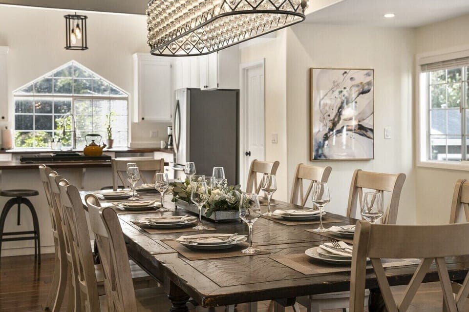 Your grand dining room table easily seating 10 guests, adorned by a rustic and modern crystal chandelier.  Break bread, share laughs, and build memories. 