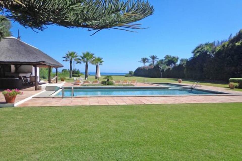 Private heated pool direct by the sea
