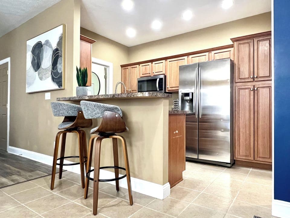 Full equipped kitchen with eat-in bar and stainless appliances!