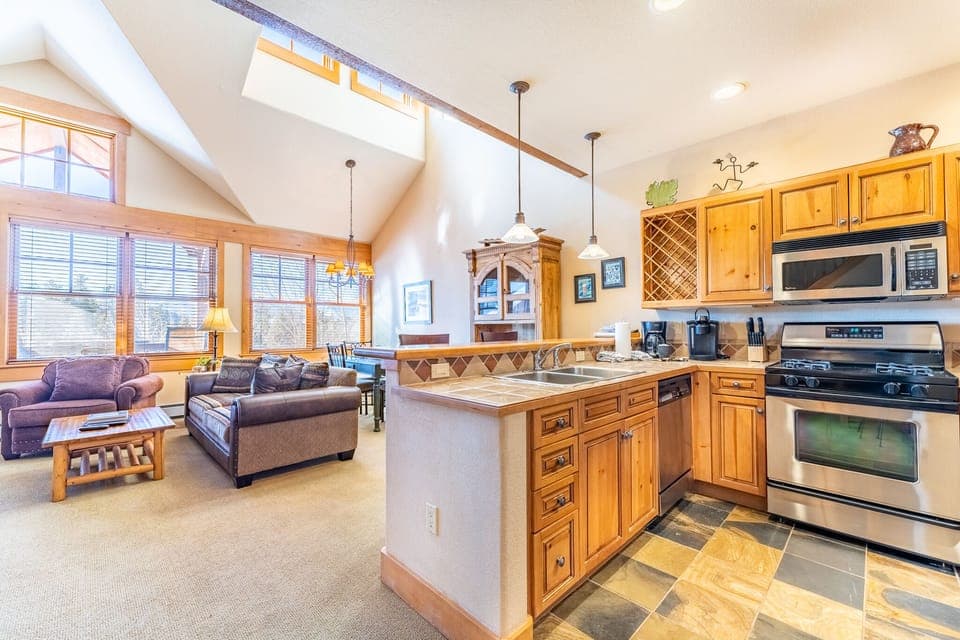 Full size kitchen with stainless steel appliances.