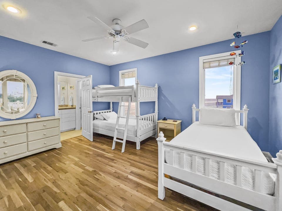 Twin over twin bunks with an additional single twin and pullout twin trundle, smart tv, private ensuite & partial beach views and neighborhood view