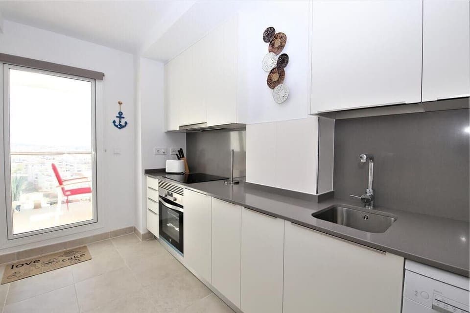 Kitchen is fully equipped and have access to the terrace
