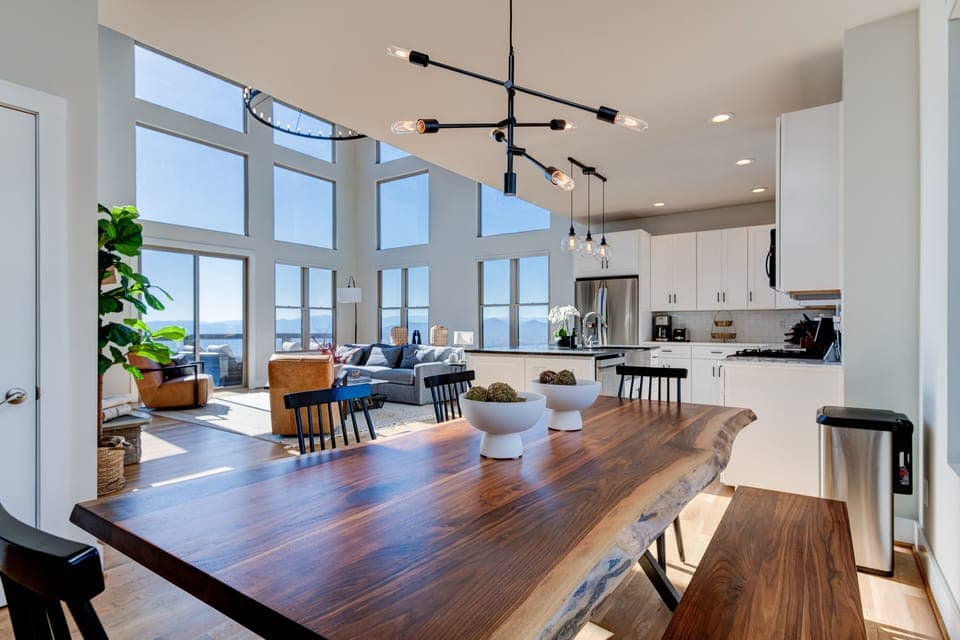 Open concept dining, kitchen, living, and balcony