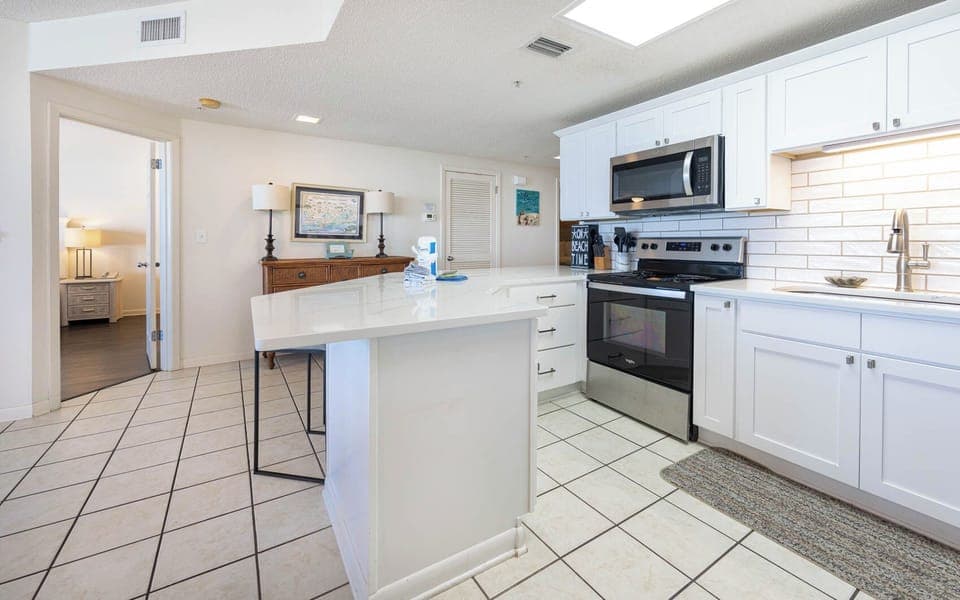 Prepare meals in the bright kitchen featuring stainless appliances and a spacious counters for casual dining