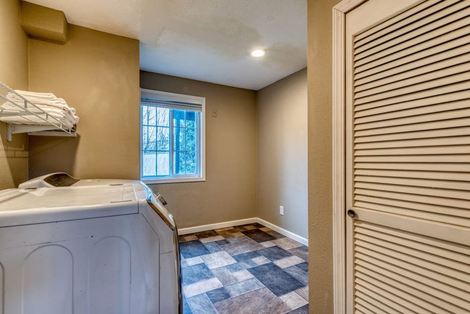 Laundry area perfect for long-term stays. It's on the GR Fl, garage door