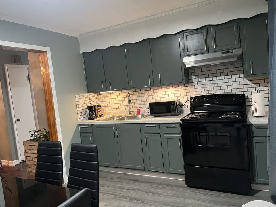 Full kitchen w/ refrigerator, stove, table & chairs for 6 and washer and dryer.