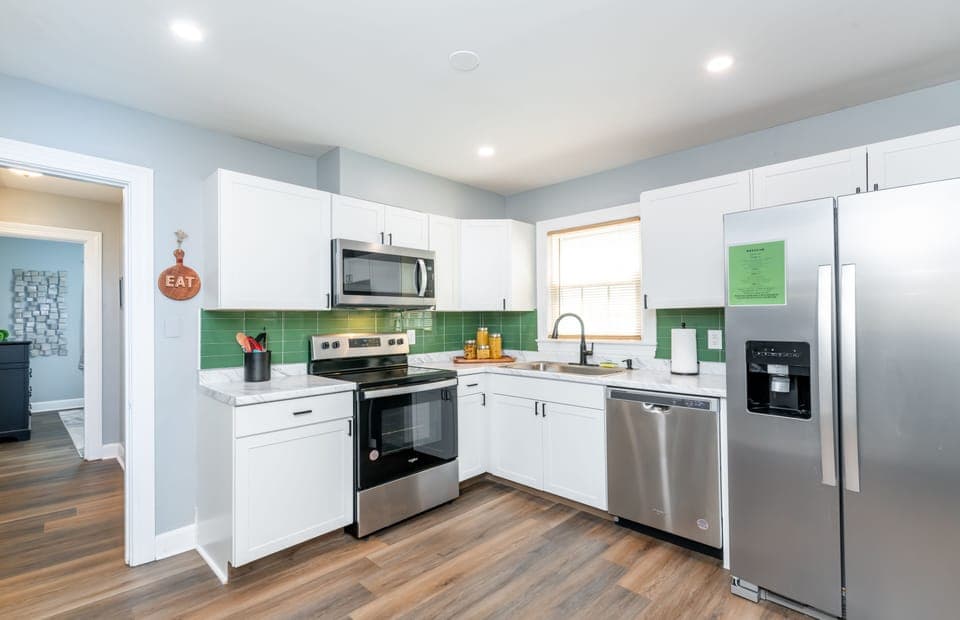 The kitchen offers ample counter space for meal prep.