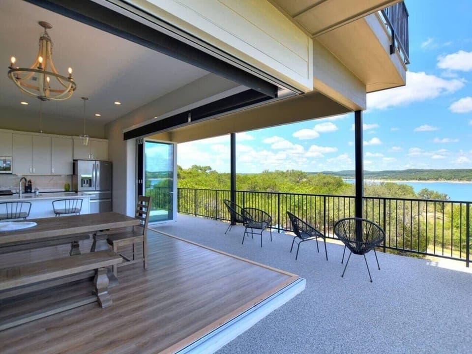 - Spacious kitchen opens to lakeview patio for easy dining time here - Bright indoor outdoor flow enhances your relaxing getaway vibes - Enjoy comfy seating while soaking in scenic water views arounda