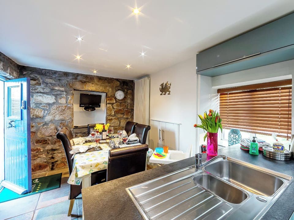Convenient dining area within kitchen/diner | Foxes Reach, Catbrook, near Tintern