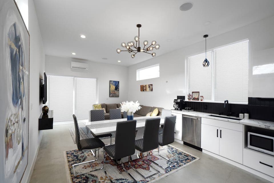 View of the living room from kitchen area. 8 seater dining table